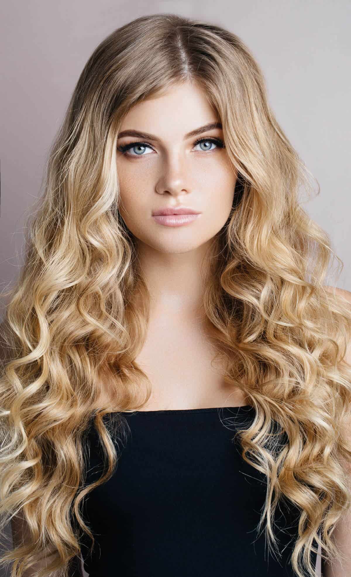 Woman with long blond curly hair